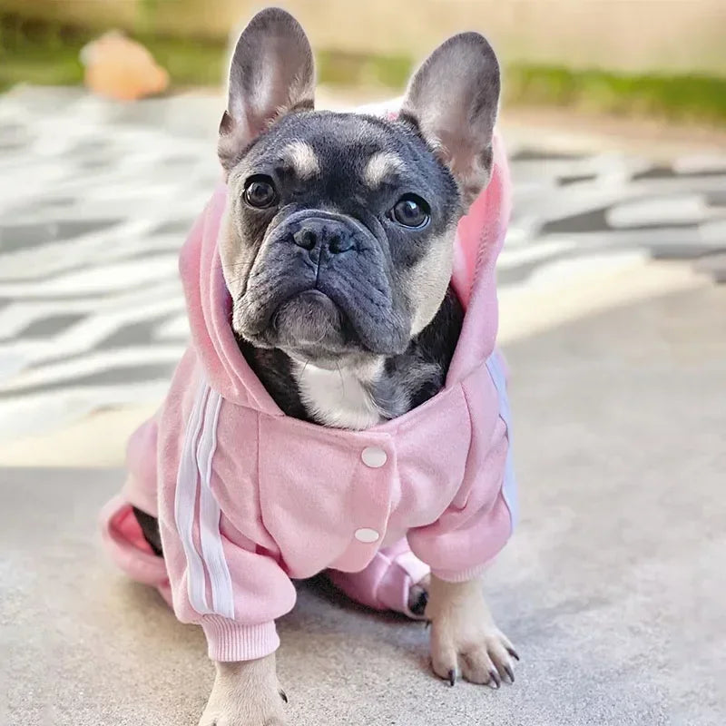 Pink dog romper jumpsuit with a sporty pattern, featuring a comfortable fit and stretch for easy dressing.